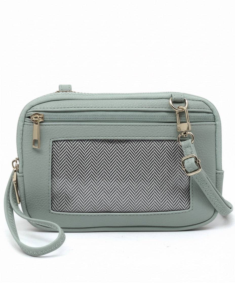 Light blue crossbody bag with a patterned pocket on a white background
